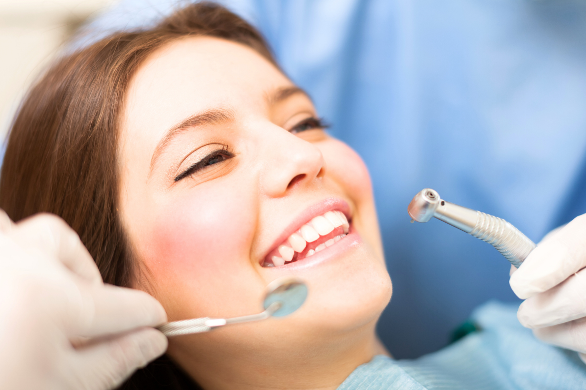A female patient smiling during a dental implants in vietnam
