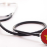 A medical stethoscope featuring the Vietnam flag, symbolizing the professional healthcare standards for cosmetic surgery in Vietnam.