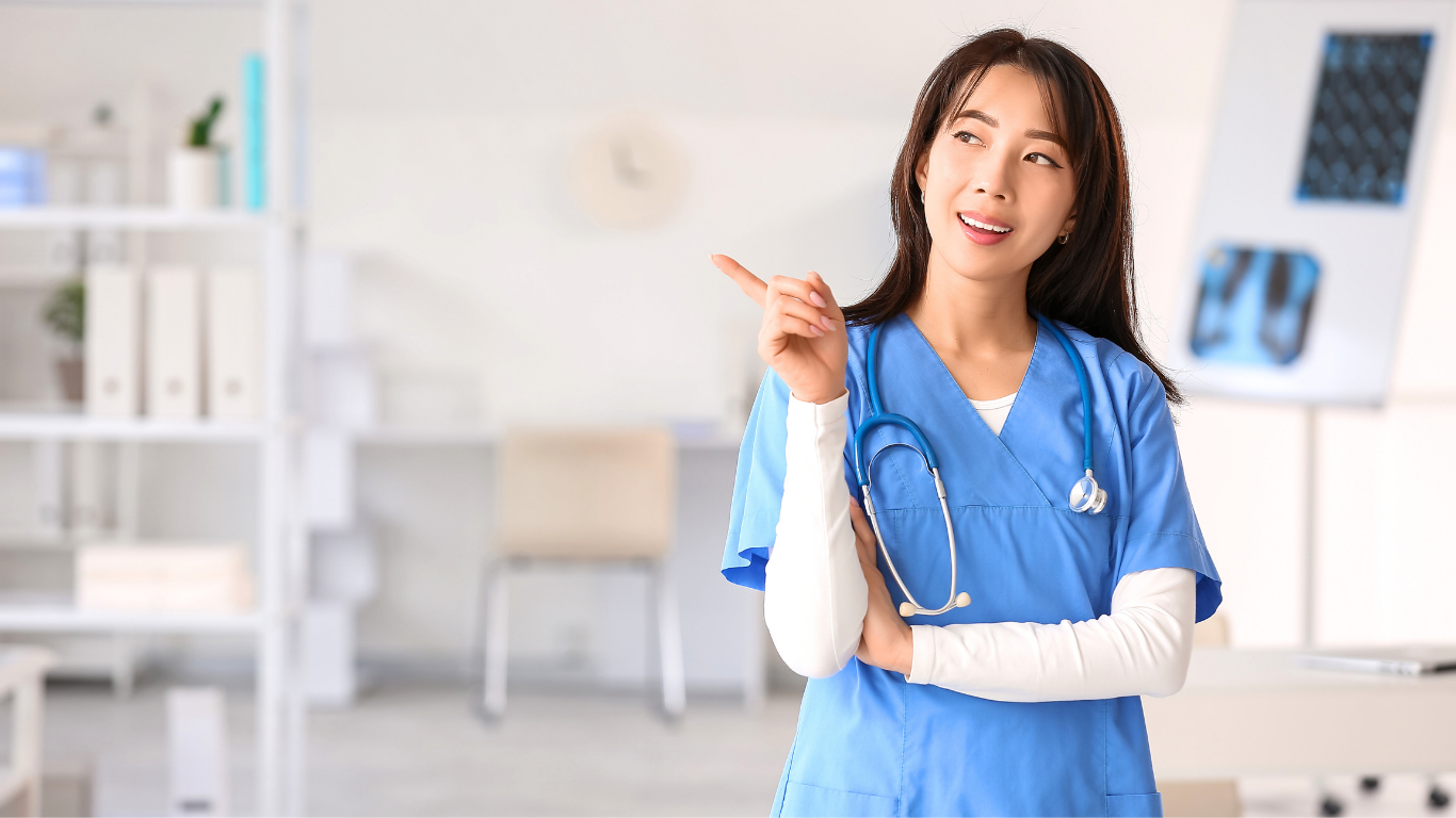 A friendly medical professional in blue scrubs ensuring cosmetic surgery in Vietnam safe