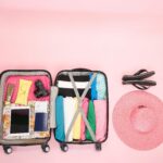 Open suitcase neatly with clothes and travel essentials. pack for surgery abroad